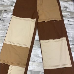 High rised brown and beige mom jeans.